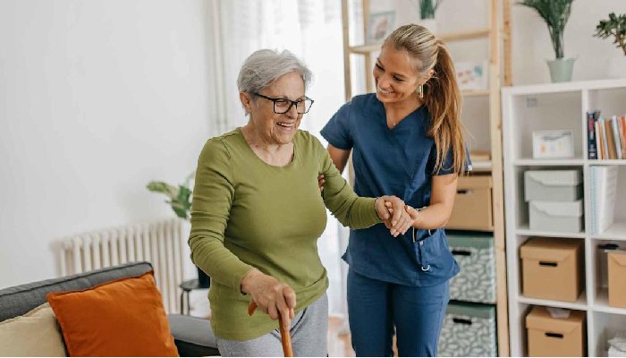 The Lady Health Assistant helping to the Gradma for walk